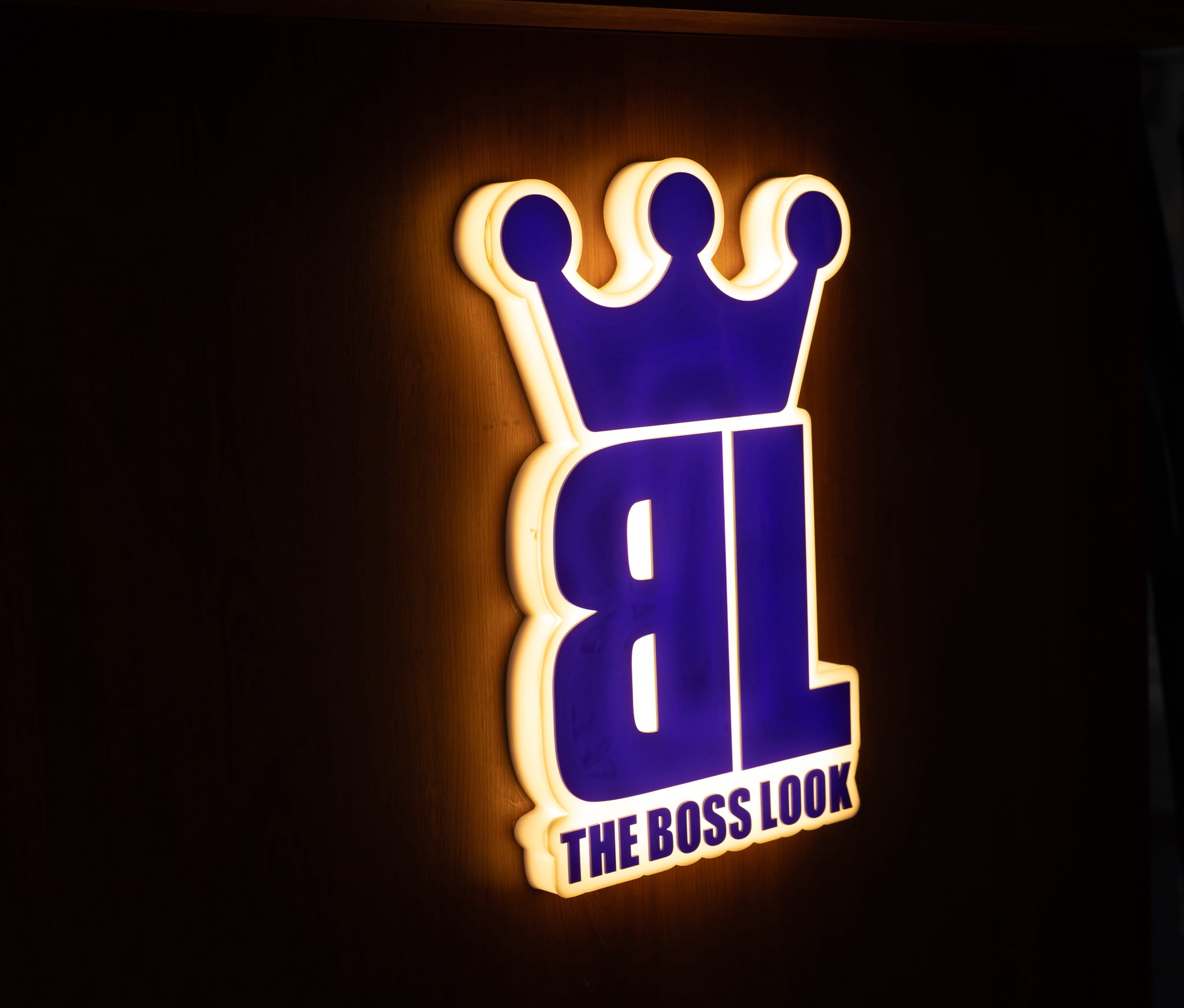 Illuminated BL logo on the shop wall