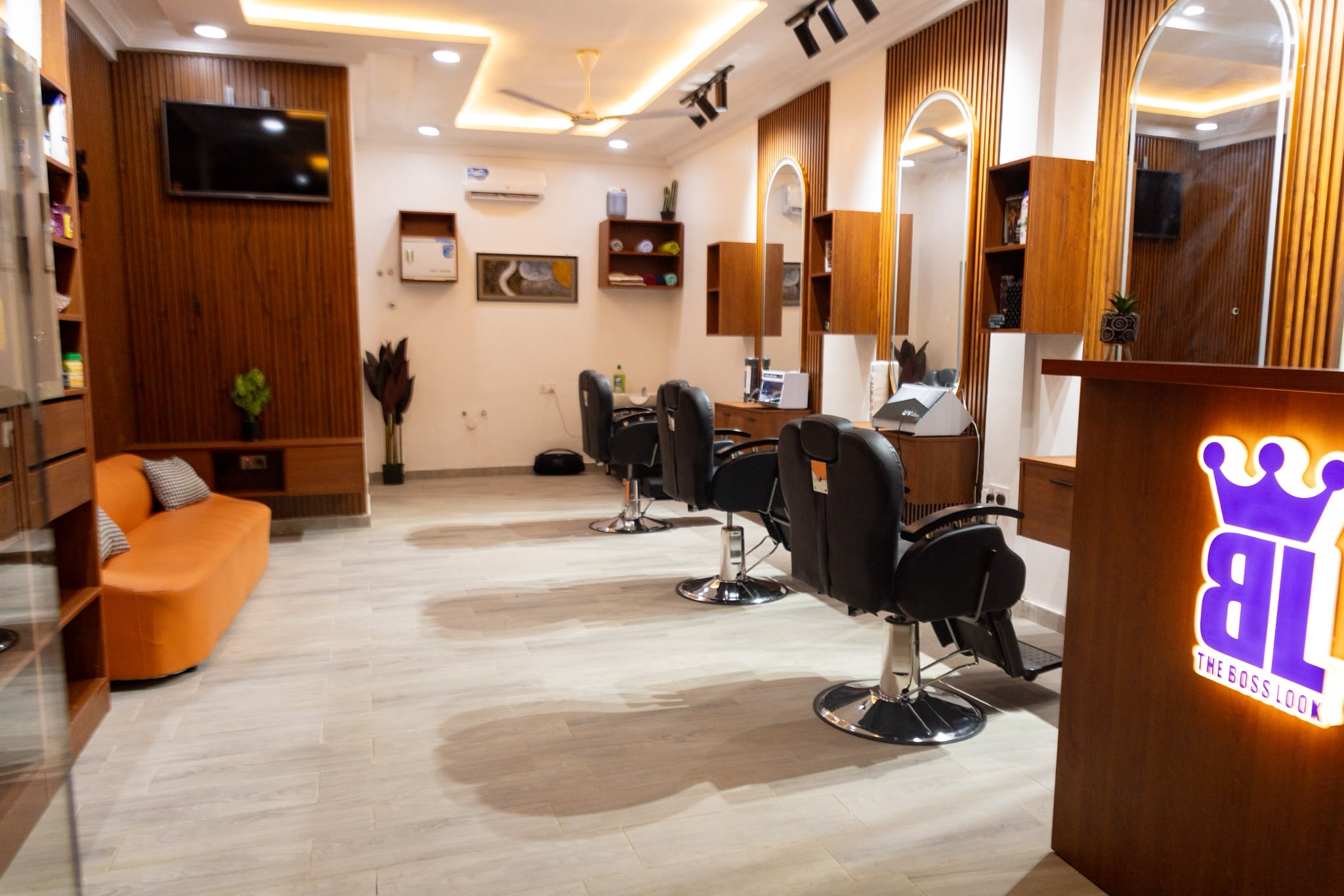 Barber chairs and mirrors inside The Boss Look studio